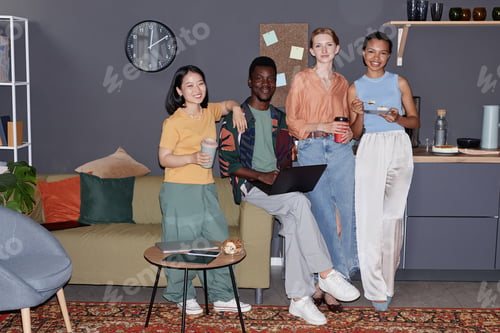 Preview: Diverse group of smiling young people enjoying work