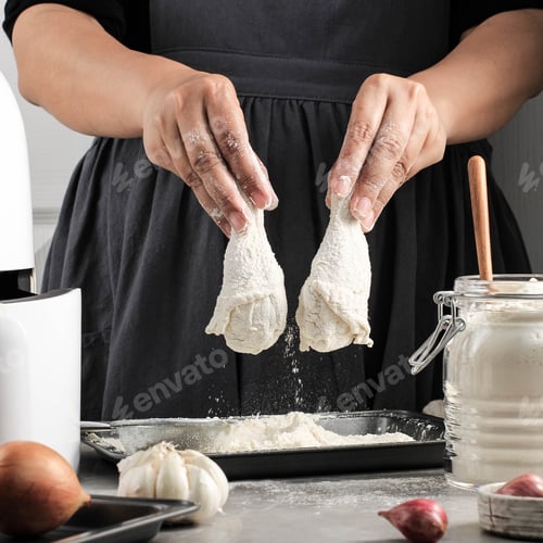 Preview: Female Home Chef Making Homemade Crispy Fried Chicken, Coating Chicken Drunsticks