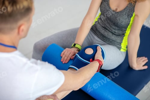 Preview: Physical Therapy Session With Exercise Equipment and Patient