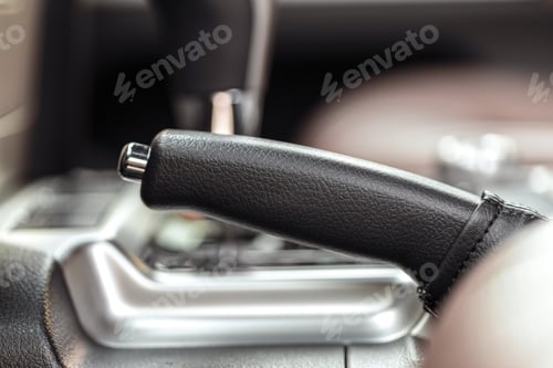 Preview: Focus on a gear stick inside a vehicle during a car ride