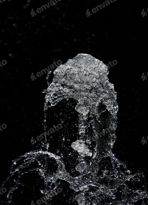 Preview: Fountain water stream and drops over black