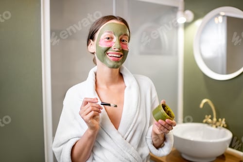 Preview: Woman with facial mask and patches in the bathroom