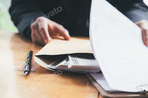 Preview: Bribery and corruption concepts. Businessman receive money.
