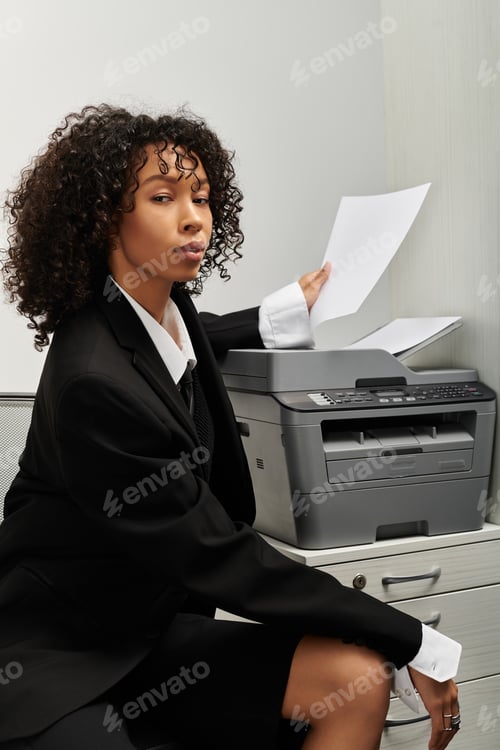 Preview: Young professional woman confidently managing office tasks and paperwork in stylish attire