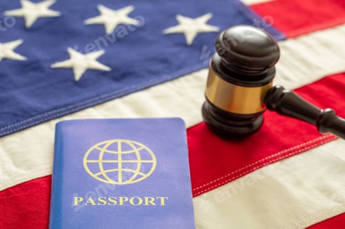 Preview: Blue passport and law gavel on USA flag background, close up view.