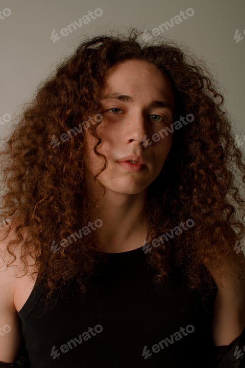Preview: Attractive And Stylish Guy With Curly Hair And A Sports Figure