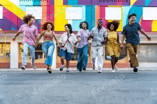 Preview: Group of Friends Holding Hands Running in Street
