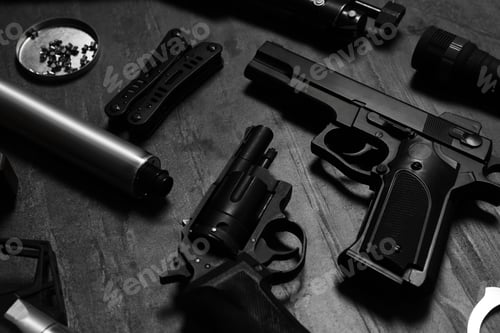 Preview: Different guns and ammunition on dark background