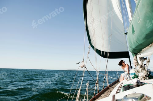 Preview: Young woman on deck of yacht