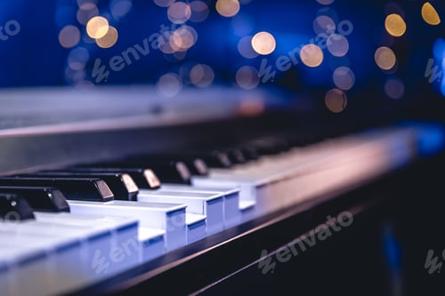 Preview: Piano keys close-up on a blurred background with bokeh.
