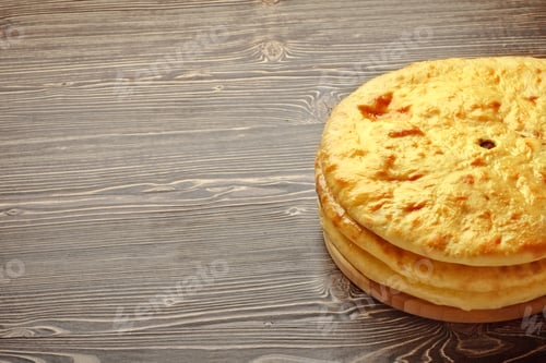 Preview: Stack of Flatbreads on a Wooden Table