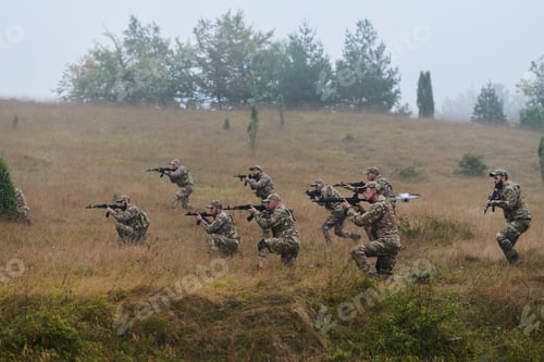 Preview: A disciplined and specialized military unit, donned in camouflage, strategically patrolling and