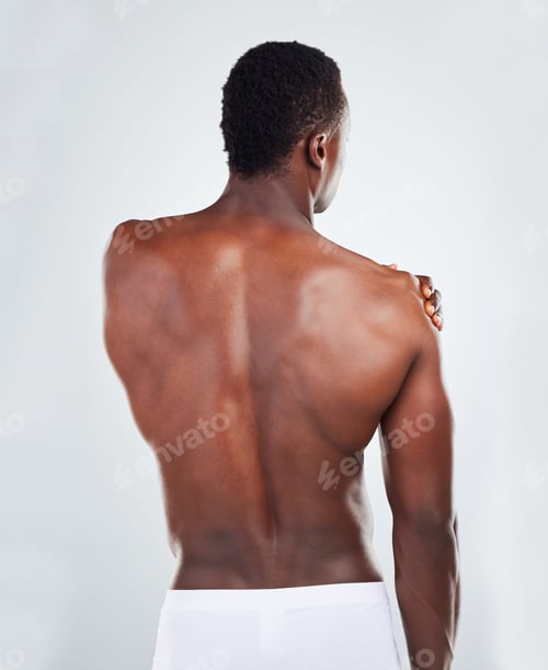 Preview: One unknown muscular fitness model experiencing shoulder pain from an injury while exercising. Blac