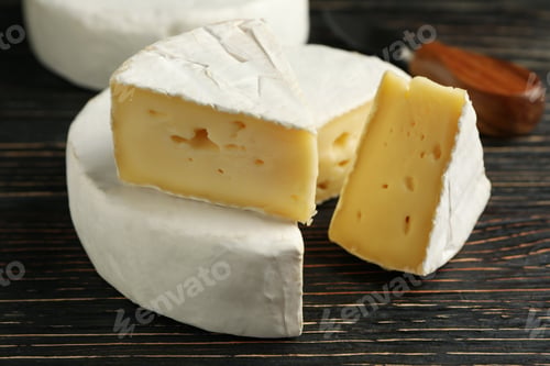 Preview: Delicious camembert cheese on wooden background, close up