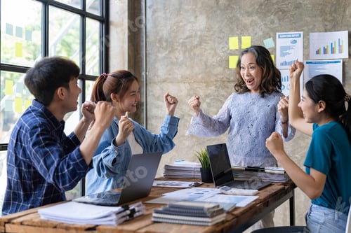 Preview: Group of young Asian businessmen raising their hands congratulating the success of the project. Pass