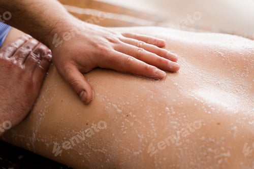 Preview: Spa salt scrub massage. Back exfoliation and rejuvenation with professional care.