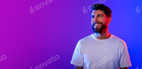 Preview: man looking aside at empty space in neon studio lights