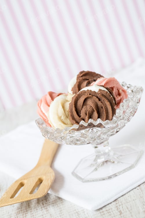 Preview: Chocolate Vanilla And Strawberry Spritz Cookies In Antique Glass Bowl With Spatula