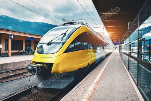 Preview: Beautiful high speed train on the railway station in mountains