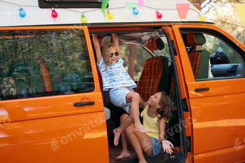 Preview: Happy children have fun on a wonderful camping day. Vanlife concept.