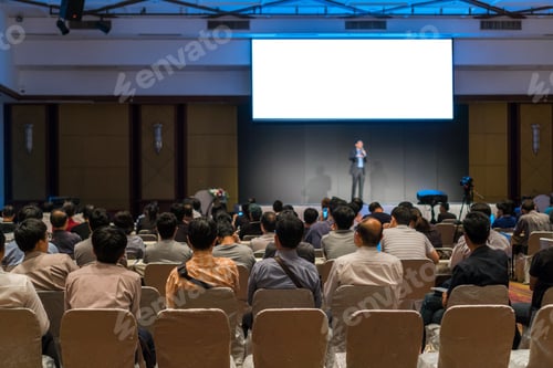 Preview: Rear side of Audiences sitting and listening the speackers on the stage in low light conference hall