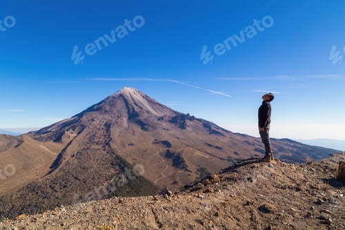 Preview: Beautiful shot of a male standing in Pico de Orizaba Volcano in Mexico