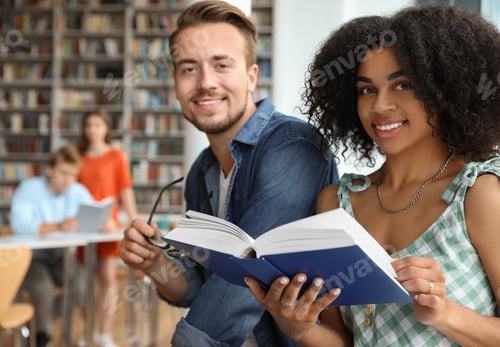 Preview: Young people studying together in modern library