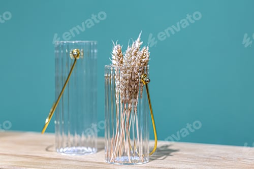 Preview: Decorative glass jars for storage on a blue background.