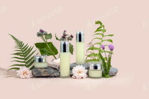 Preview: Bottles for cosmetics made of glass on a stone podium