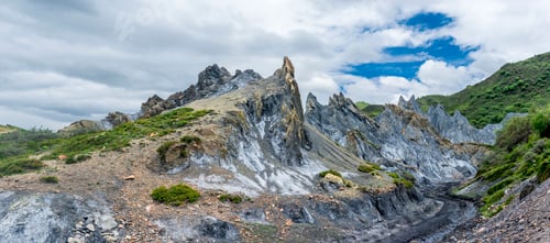 Preview: Picturesque view of top of mountains between clouds