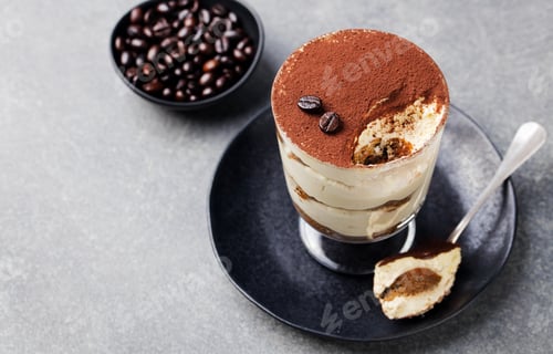Preview: Tiramisu, Traditional Italian Dessert in Glass on a Grey Stone Background. Copy Space.
