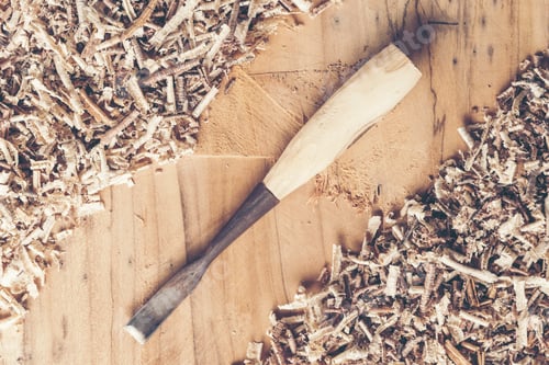Preview: Carpenter tools on wooden table with sawdust. Carpenter workplace top view