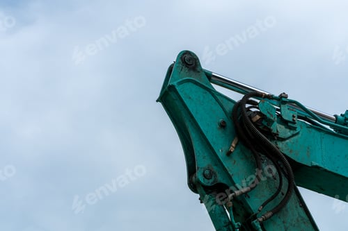 Preview: Close up of excavator machine against sky with copy space