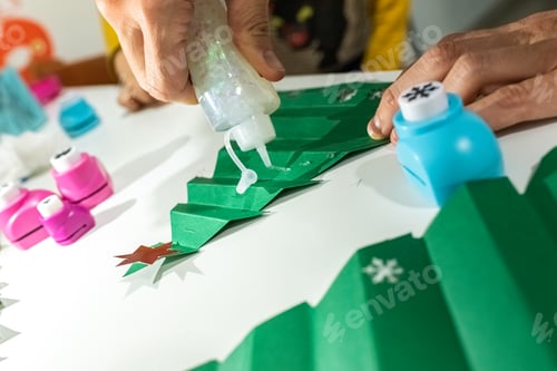 Preview: Christmas crafts with colored paper and glue.