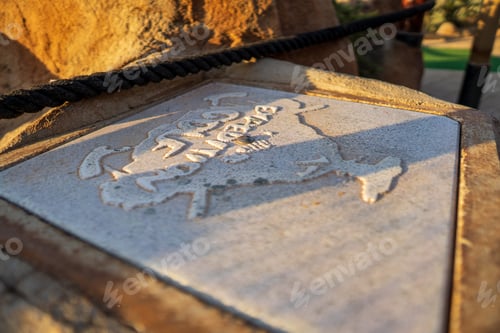 Preview: Closeup shot of an ancient writing carved on stone at sunlight