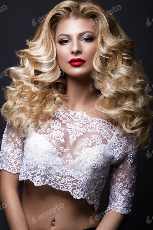 Preview: Beautiful blonde bride in wedding image with curls, red lips. Beauty face.