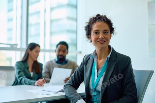 Preview: Businesswoman in Meeting with Colleagues at Office