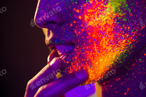 Preview: Fashion model with fluo painting on the face