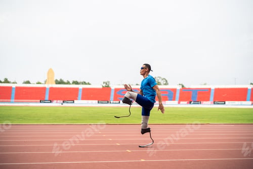 Preview: Asian athletes are disabled with prosthetic blades running at stadium.
