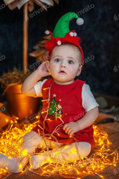 Preview: The little baby is sitting and enjoying. The concept of Merry Ch