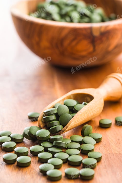 Preview: Green chlorella pills or green barley pills.