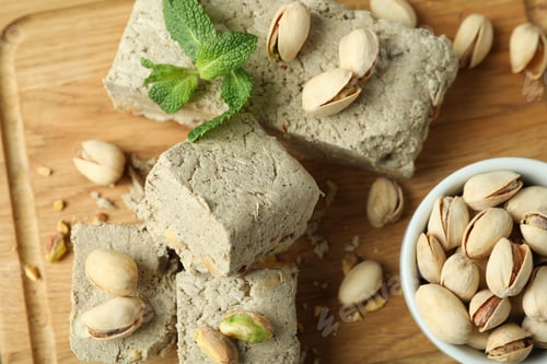 Preview: Concept of tasty food with halva on wooden background
