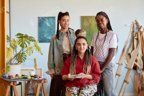 Preview: Portrait of Diverse Young Adult Women Posing Together in Art Studio Setting