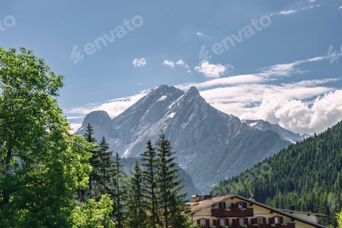 Preview: Beautiful landscape with building near rocky mountain