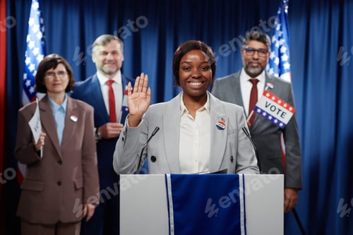 Preview: Cheerful female politician taking oath