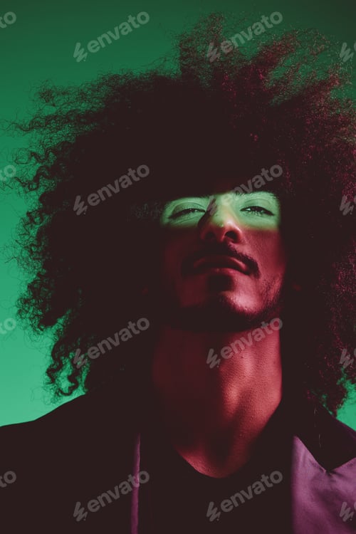 Preview: Portrait of a stylish man in a jacket on a green background multinational, color light, trend.