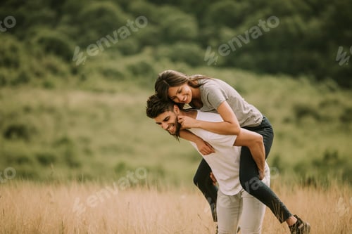 Preview: Pretty young couple in love outside in spring nature