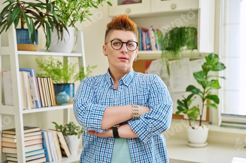 Preview: Portrait of smiling confident middle-aged woman in glasses with red haircut