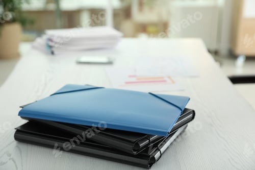 Preview: Stack of folders with documents on office table. Space for text