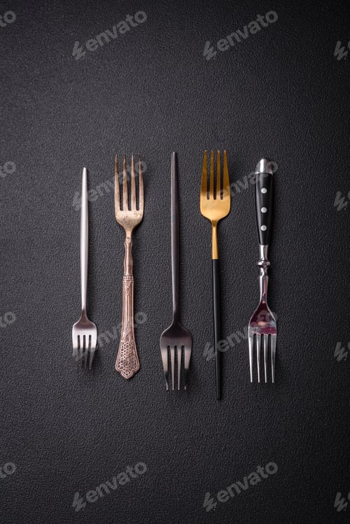 Preview: Kitchen fork made of steel on a dark textured background